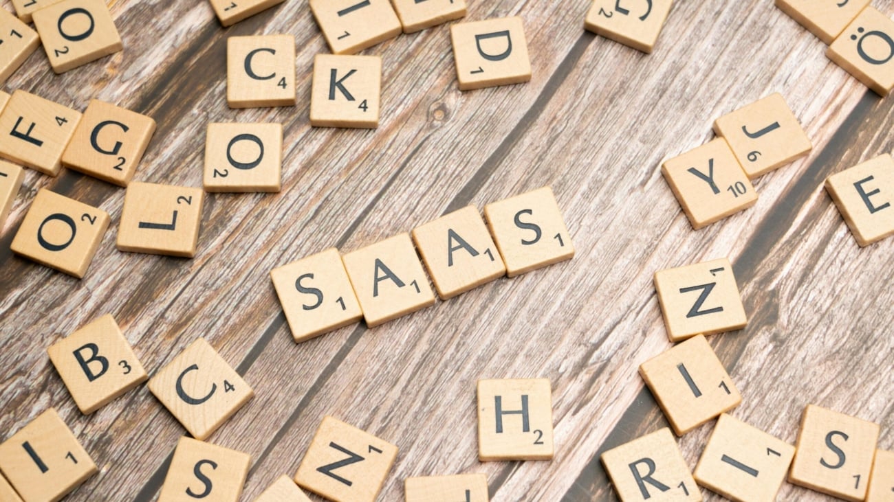 scrabble-letters-spelling-saas-on-a-wooden-tabl